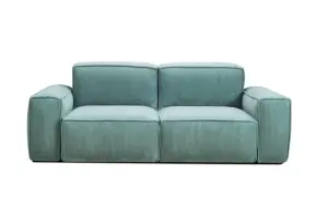 Divano sfoderabile in velluto a coste color acquamarina, perfetto per lavare poltrone e sofà con facilità.