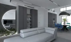 Un soggiorno moderno con divano grigio chiaro, pareti in vari tipi di grigio, specchio circolare illuminato e zona pranzo con sedie colorate.
