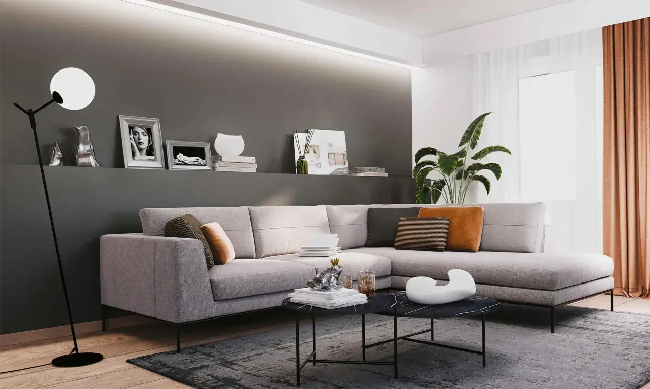 Illuminazione sopra divano, con lampada da terra moderna e faretti a soffitto che creano un'atmosfera accogliente.