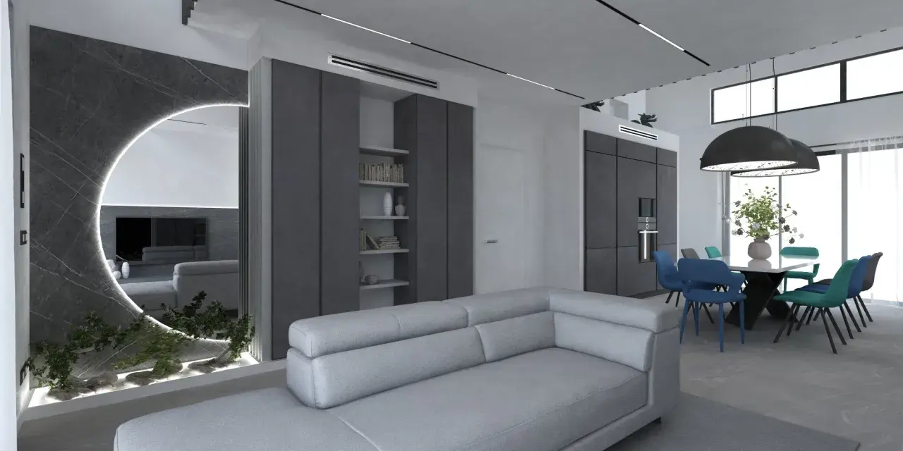 Un soggiorno moderno con divano grigio chiaro, pareti in vari tipi di grigio, specchio circolare illuminato e zona pranzo con sedie colorate.